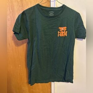 Green Graphic Tee with Orange Design
